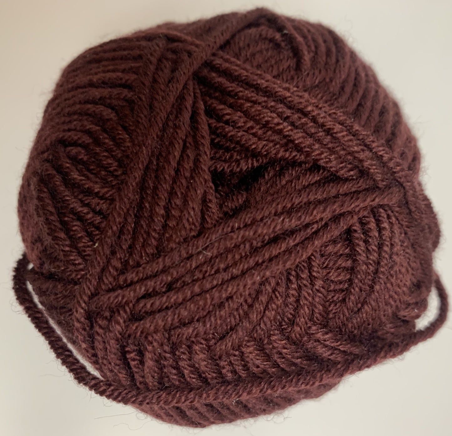 Debbie Bliss Baby Cashmerino yarn 028 Wine, close-up of yarn texture